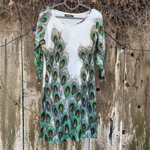 Peacock feathers dress with long sleeves.